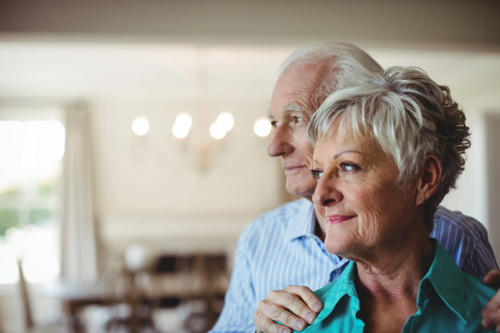 Senior couple in emergency relocation accommodation for insurance claims