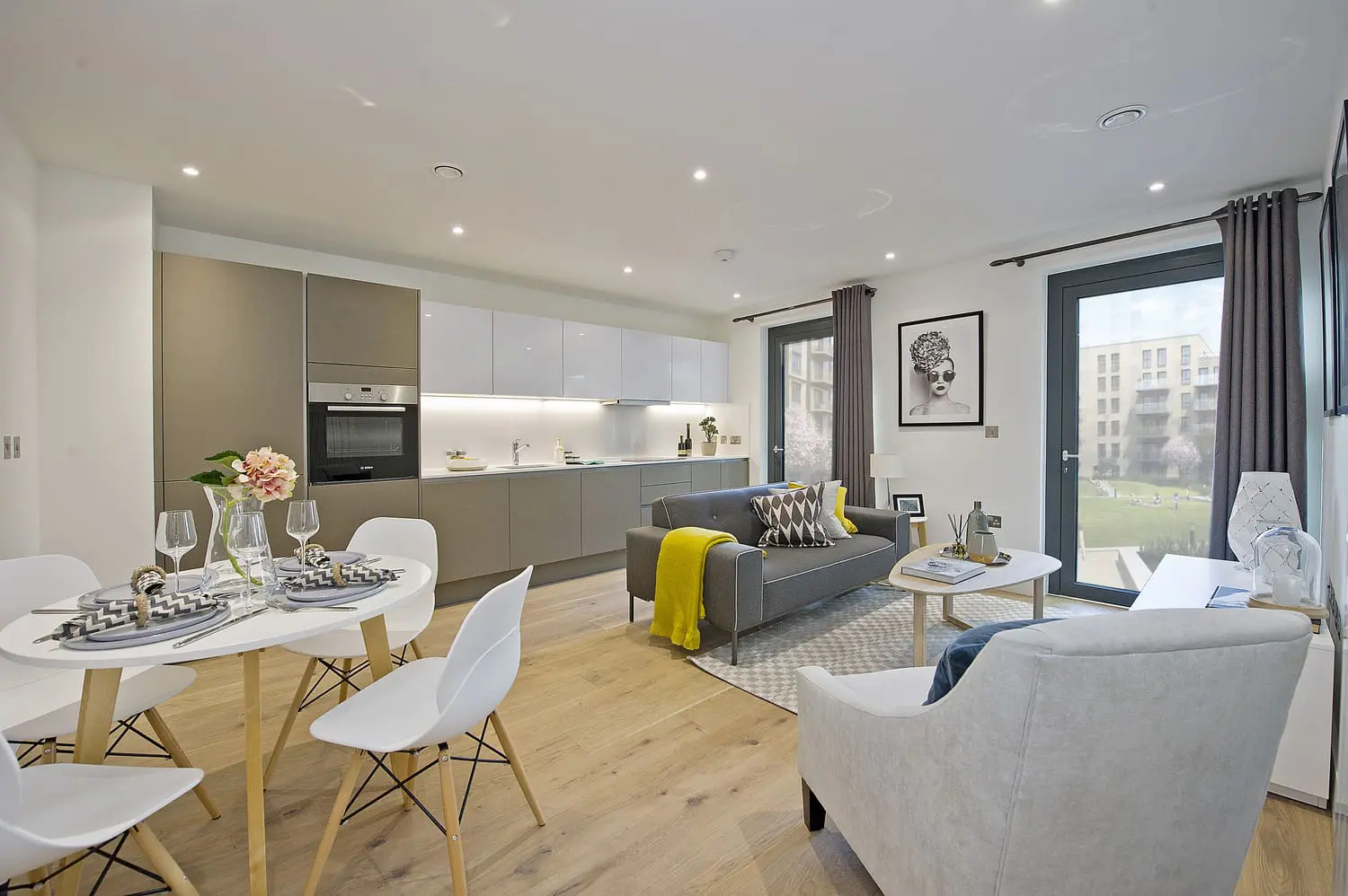 Living and dining area with large windows in a Serviced Apartments for Insurance Housing