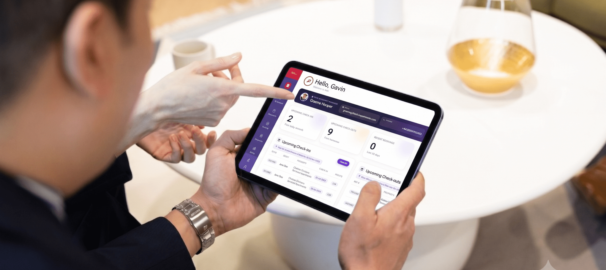 A client using the Axis portal on a tablet, viewing upcoming check-ins and check-outs